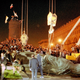 A crowd in this August 23, 1991 file photo is gathered while a statue of police chief Felix Dzerzhinsky is toppled at the KGB headquarters in Moscow (AP Photo/Alexander Zemlianichenko)